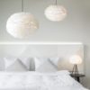 available in five sizes from small to extra-extra large each round lampshade is adorned with white goose feathers - cord sets available in white or black
