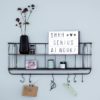 industrial style black metal two shelf wall unit with six hanging hooks