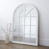 large arched wooden window wall mirror with a painted white distressed frame