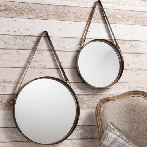 set of two industrial style round hanging mirrors with leather straps