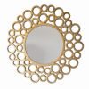 round gold wall mirror with small circular bubble frame
