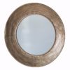 circular wall mirror with a wide ribbed copper frame