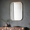 rectangular mirror with curved corners finished in a champagne silver leaf
