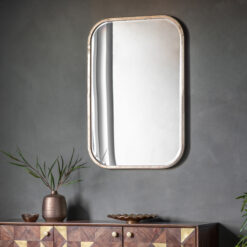 rectangular mirror with curved corners finished in a champagne silver leaf