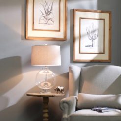 large glass ball table lamp sat on a solid crystal square base and collar and finished with a grey and white herringbone 40cm drum lampshade