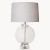 large glass ball table lamp sat on a solid crystal square base and collar and finished with a grey and white herringbone 40cm drum lampshade