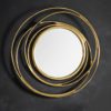 round gold metal framed wall mirror with a swirl design finished in a gold leaf