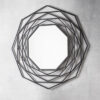 contemporary black metal framed wall mirror made up of six layers of octagonal shapes forming a geometrical design