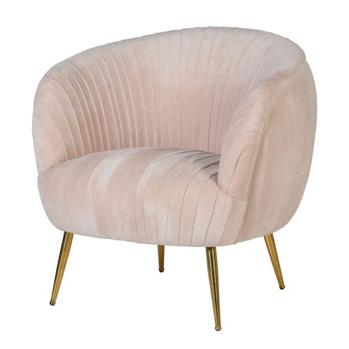 a rounded tub chair upholstered in a pleated blush pink velvet with tapered gold legs