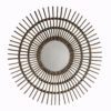 round wall mirror with a starburst style rattan frame and central round mirror