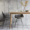 set of four retro style plastic dining chairs with padded seat and metal cross frame legs - available in grey, white or black