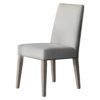 a pair of high-backed dining chairs upholsterd in a natural linen and finished with ash wooden legs