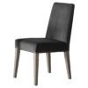 a pair of high-backed dining chairs upholsterd in a mink velvet and finished with ash wooden legs