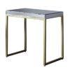 rectangular side table comprising of a champagne gold metal framed base and raised mirrored glass top