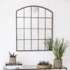 black metal framed window mirror with curved top