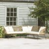 large outdoor corner sofa with all weather bamboo seating on a powder coated black steel frame complete with set pads and six cushions