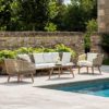 contemporary outdoor lounge set comprising of two-seater sofa and two armchairs made from weatherproof rope wrapped around an aluminium frame with wooden legs and seat pads and cushions - also includes curved poly-cement topped coffee table