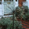 large solar powered starburst light on a pole in black