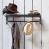 industrial style black steel luggage rack with one shelf and four hanging hooks
