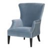 large sky blue velvet wingback armchair with silver stud details and black wooden legs