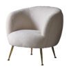 off white tub chair with a cosy fleece upholstery with brass pin legs