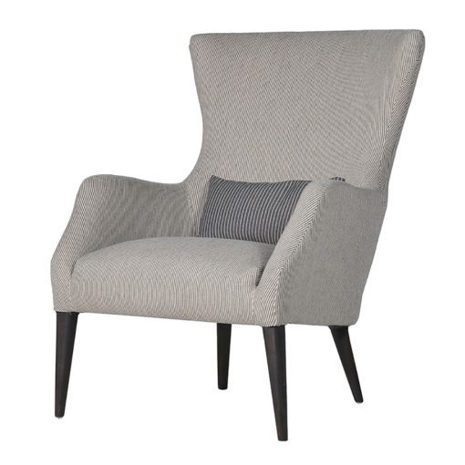 large wingback armchair upholstered in a grey and white pinstripe fabric with black wooden legs