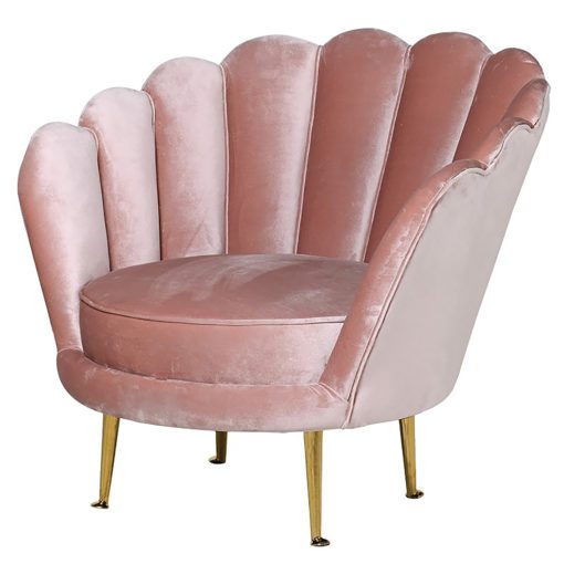 rose pink velvet round tub chair with a scalloped base and brass stick legs