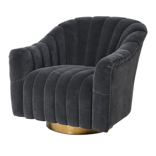 contemporary dark grey velvet upholstered club armchair with deep seems and sat on a circular brass base