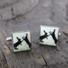 hand-enamelled square cufflinks made from brass with a nickel coating with the silhouette of black boxing hares