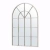 cream metal framed arched window mirror with a lightly distressed finish