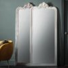 floor length mirror with decorative curved top finished in white or silver