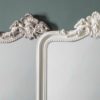 floor length mirror with decorative curved top finished in white or silver