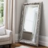 highly decorative rococo framed full length mirror finished in an aged silver leaf