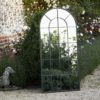 tall metal framed arched garden window mirror