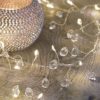 fairy light garland decorated with wired clear crystal beads and warm white lights
