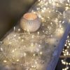 fairy light garland decorated with wired clear crystal beads and warm white lights