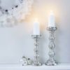 large silver pillar candle holders with a horizontal ribbed design available in two sizes
