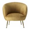 rounded tub chair upholstered in a pleated gold velvet with gold stick legs