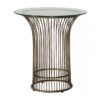 round side table with a bronzed metal stemmed base and glass top