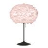 black fluted table stand with built in usb charging port topped with a blush pink feather lampshade