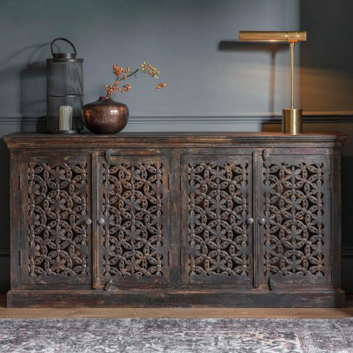 large wooden four door sideboard with decorative carved doors