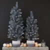 faux bushy nordic style indoor faux potted christmas trees with a mix of glittery and frosted branches available in three sizesfrosted branches