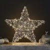 large three dimensional wire framed star adorned with clear crystals and warm-white led lights