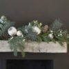 faux pine fir christmas garland decorated with rustic white baubles, berries, pine cones and faux eucalyptus