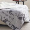fleecy lined cosy soft throw with a grey and white stag motif design