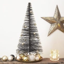 large black bristle brush christmas tree with gold glitter tips and gold shiny baubles
