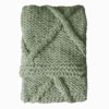 loose knit sage green chunky cable knit throw with diamond design