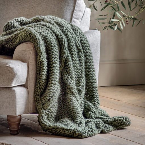 chunky throw with a loose cable knit in forest green