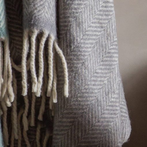 light grey and cream pure wool herringbone throw with cream braided fringe