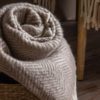 stone and cream pure wool herringbone throw with cream braided fringe